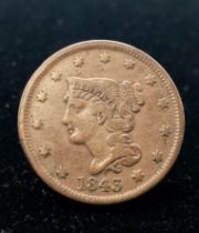 A 1843, USA One Cent Coin. See photos for condition.