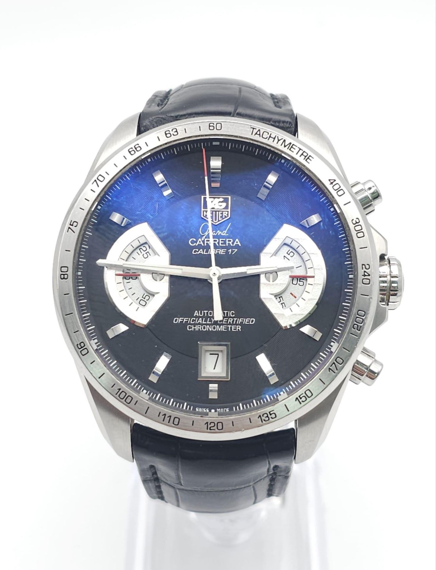 A TAG HEUER "GRAND CARRERA" AUTOMATIC CHRONOMETER WITH SKELETON BACK AND ON THE ORIGINAL TAG LEATHER