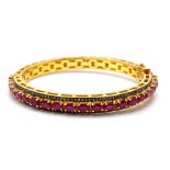 A Sophisticated Ruby and Diamond Gemstone Bangle/Bracelet. Clip-open style with approx 3.5ctw of