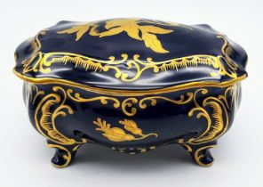 A NICELY DECORATED KOBALT TRINKET BOX. 17 X 10cms and 12cms in height