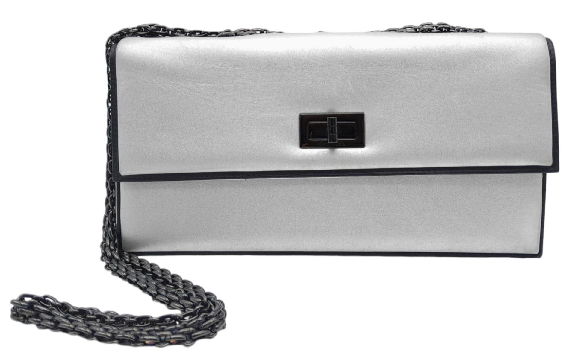 Chanel Silver Leather Flap Bag. Stunning quality throughout, this bag features a slip chain