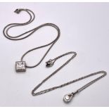 2X 925 silver Cubic Zirconia pendants on silver chains. Total weight 9.72G. Both have length of 46cm