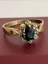 9 carat GOLD and SAPPHIRE RING . Having an oval cut SAPPHIRE set to top with DIAMOND Surround.
