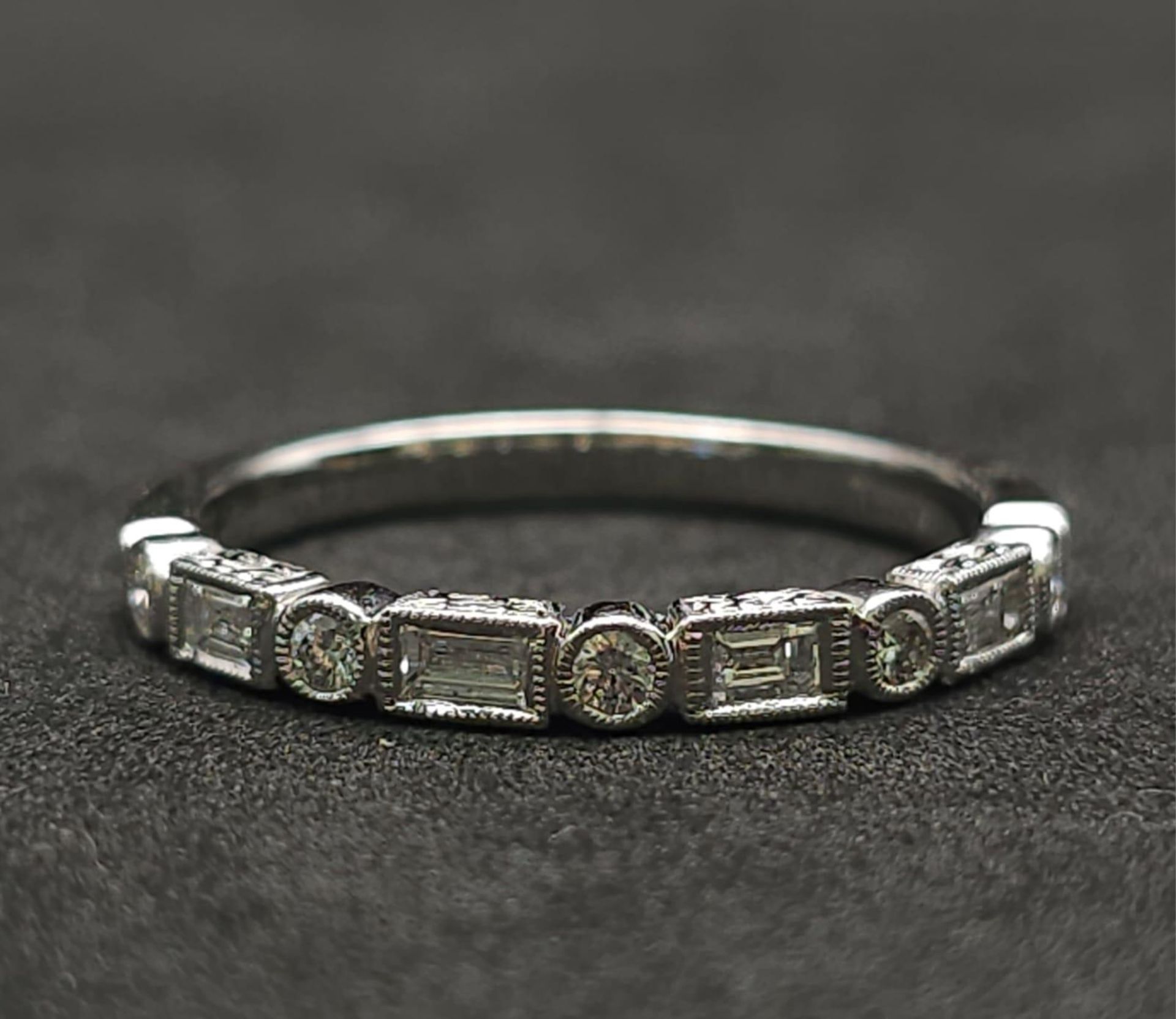 A 9K White Gold and Diamond Half Eternity Ring. Size N. 2g total weight. - Bild 4 aus 7