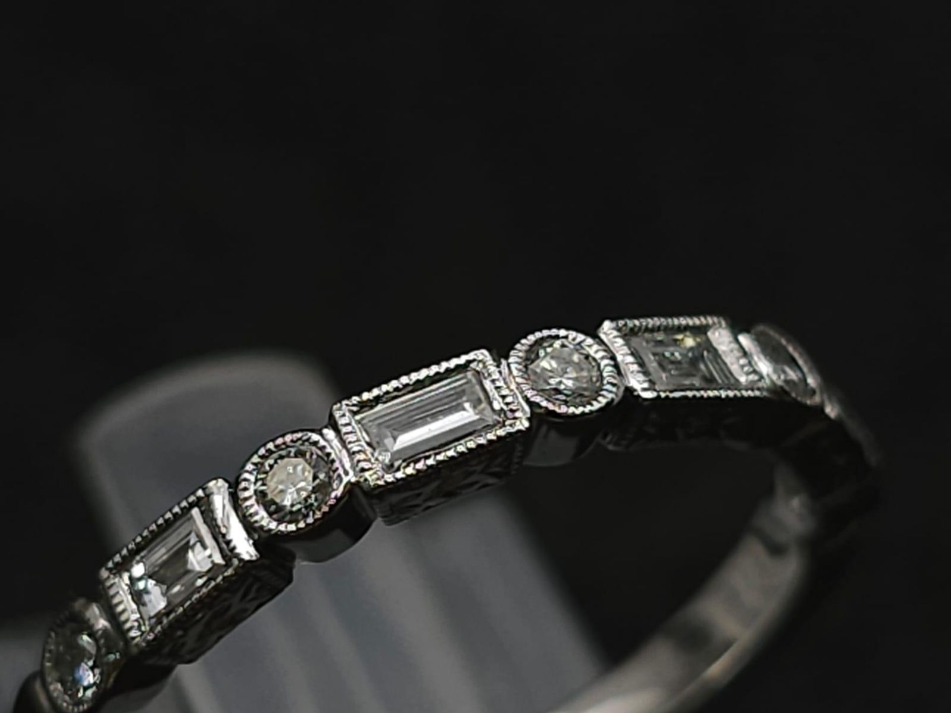 A 9K White Gold and Diamond Half Eternity Ring. Size N. 2g total weight. - Bild 3 aus 7