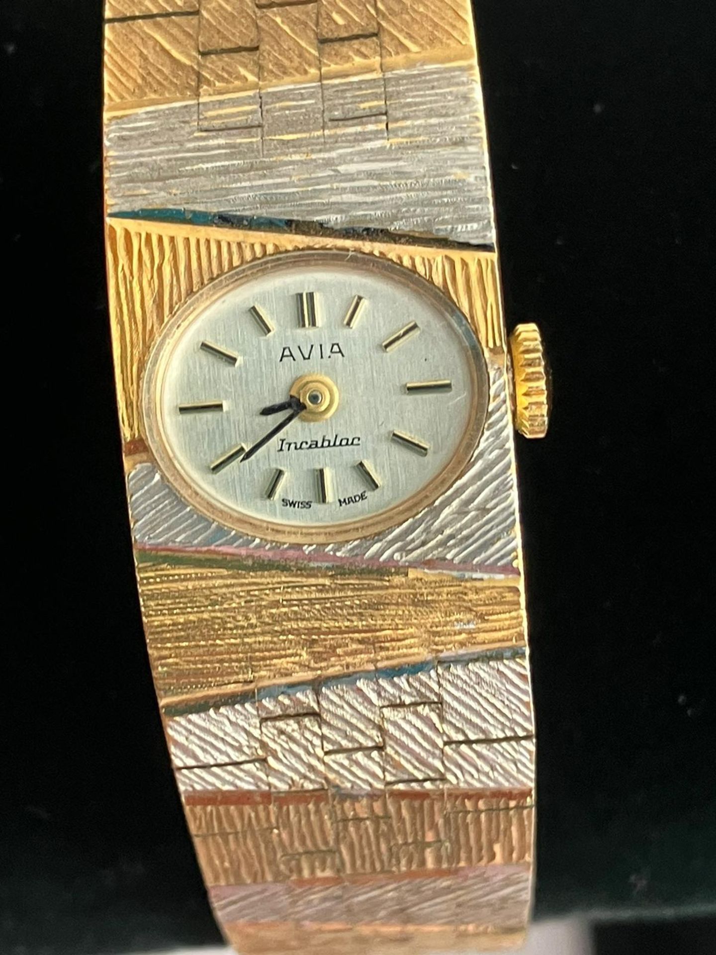 Ladies Beautiful vintage AVIA BRACELET WATCH. Finished in gold and silver tone. Face showing