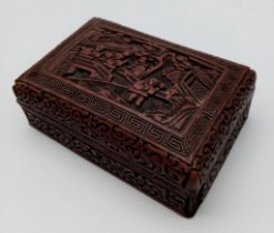 An antique Chinese Cinnabar Trinket Box. This wonderful lidded box depicts a village scene full of