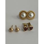 3 x pairs 9 carat GOLD EARRINGS. To include Split Pearl, Garnet, and Gold Ball Stud.. 1.04 Grams.