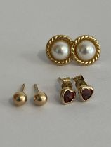 3 x pairs 9 carat GOLD EARRINGS. To include Split Pearl, Garnet, and Gold Ball Stud.. 1.04 Grams.