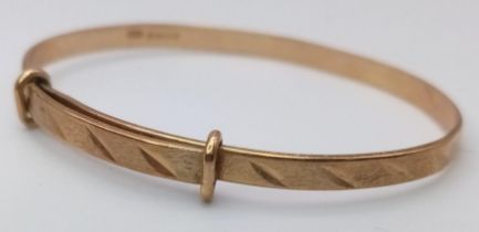 A Vintage 9K Yellow Gold Expandable Baby's Bangle. 2.86g weight.