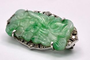 A Wonderful Art Deco Platinum, Diamond and Jade Brooch. A Chinese green and white pierced decorative
