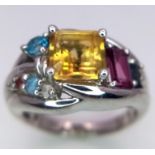 A Sterling Silver Multi- Semi Precious Gemstone Set Ring Size O. The ring is set with a Centre 6mm