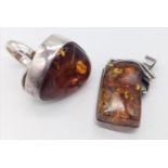 A STERLING SILVER AMBER SET RING. SIZE R & A STERLING SILVER AMBER SET PENDANT. 35.4G IN TOTAL