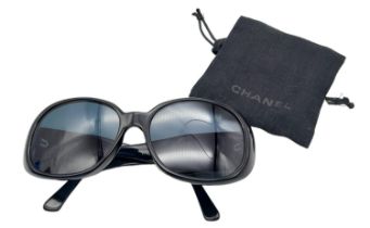 Black Chanel Sunglasses with Floral Motifs. Built to be worn whilst driving a small convertible car,