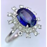 A 950 Platinum, Diamond and Sapphire Ring. Central 2.79ct Sri Lankan oval sapphire with a double