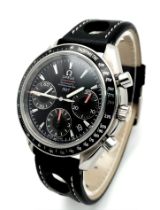 AN OMEGA "SPEEDMASTER" AUTOMATIC CHRONOGRAPH (1957) WATCH WITH 3 SUBDIALS AND ON A BLACK LEATHER