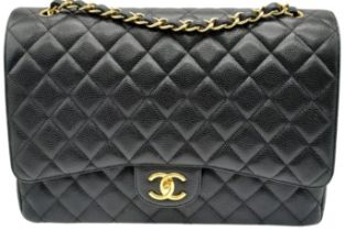 Black Chanel Maxi Bag. Quilted leather stitched in diamond pattern. Gold toned hardware and