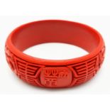 An iconic, Chinese, hand carved, traditional cinnabar bangle in its original presentation box. Inner