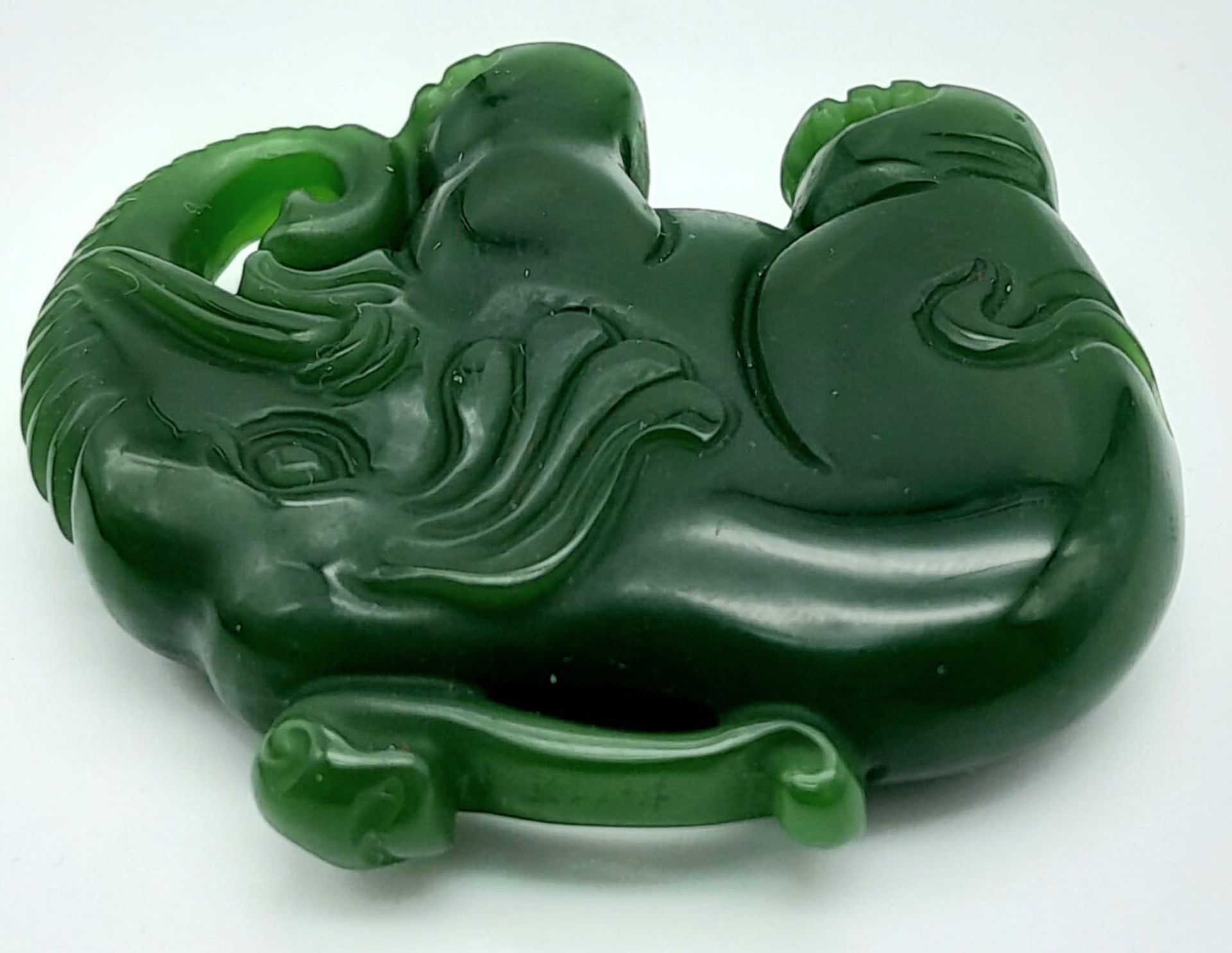 A Green Jade Chinese Hand-Carved Elephant Pendant. 5cm x 4cm. - Image 2 of 4