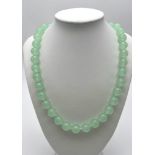 A Lime Green Jade 12mm Bead Necklace. Lifesaver clasp. Necklace length - 44cm.