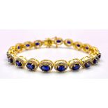A stunning Oval-cut, Blue Sapphire, Gold gilded Sterling Silver, Tennis Bracelet with Diamond