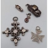 A collection of vintage silver charms/pendants: Garnet drop, car, clog, Byzantine cross and filigree