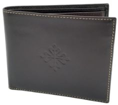 Patek Philippe Brown Leather Men's Wallet. Embossed motif on front, quality stitching throughout