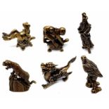 Collection of 6 Brass Figurines. Featuring Monkeys on Turtle, a Dragon, Tiger, Hawk, a Ancient Man
