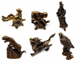 Collection of 6 Brass Figurines. Featuring Monkeys on Turtle, a Dragon, Tiger, Hawk, a Ancient Man