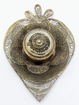 A vintage white metal heart shaped ink well. Very ornate and elaborately designed. Measures 7.5cm