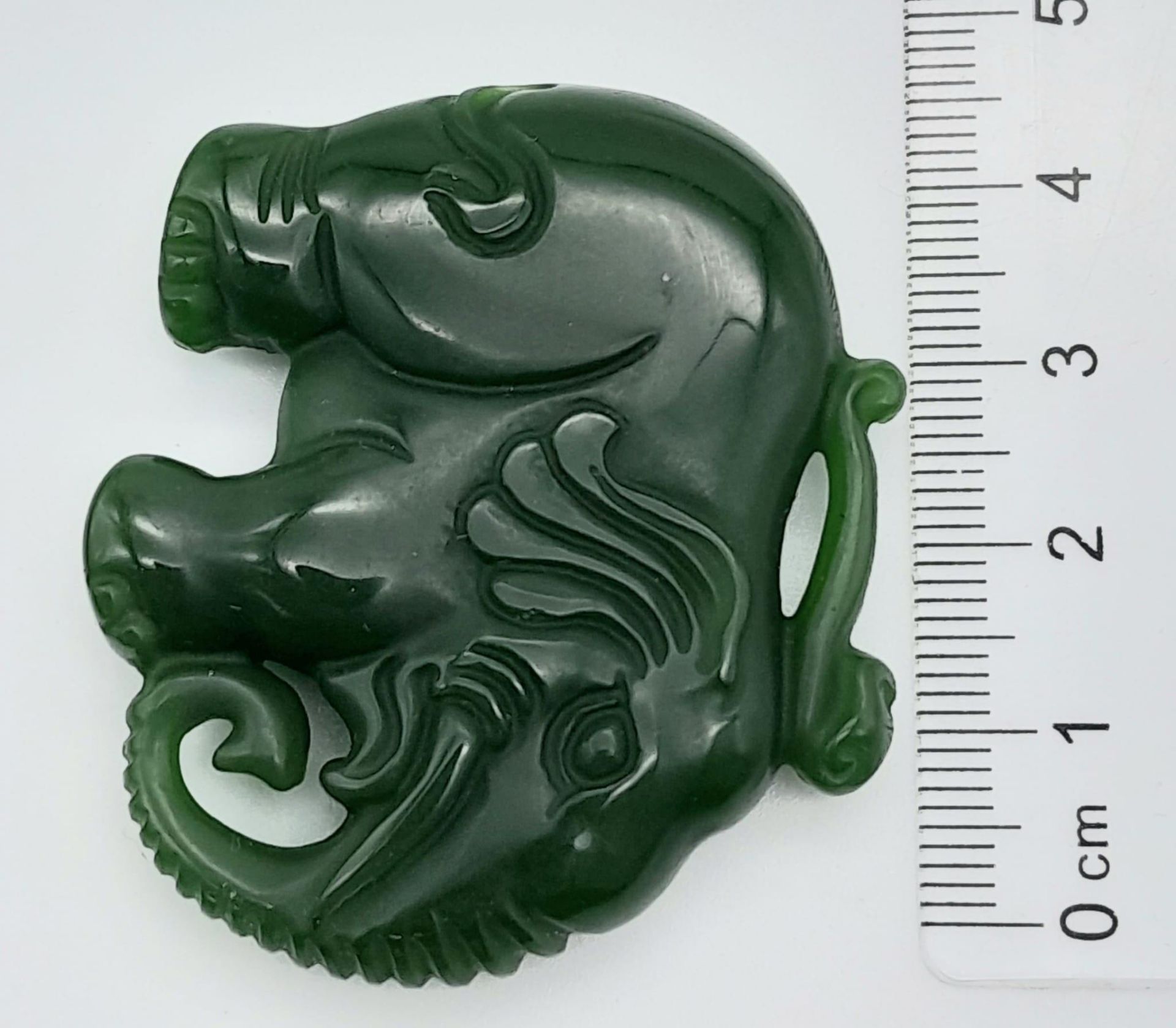 A Green Jade Chinese Hand-Carved Elephant Pendant. 5cm x 4cm. - Image 4 of 4