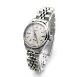 A VINTAGE LADIES ROLEX OYSTER PERPETUAL IN STAINLESS STEEL , WITH AUTOMATIC MOVEMENT AND