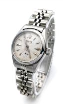 A VINTAGE LADIES ROLEX OYSTER PERPETUAL IN STAINLESS STEEL , WITH AUTOMATIC MOVEMENT AND