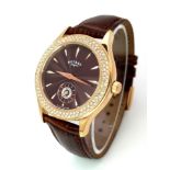 A Rotary Gold Plated and White Stone Quartz Ladies Watch. Brown leather strap. Brown dial with sub