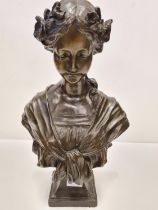 A Vintage Art Nouveau Style Bronze Bust of a Beautiful Young Girl with Flowers in her Hair. Made