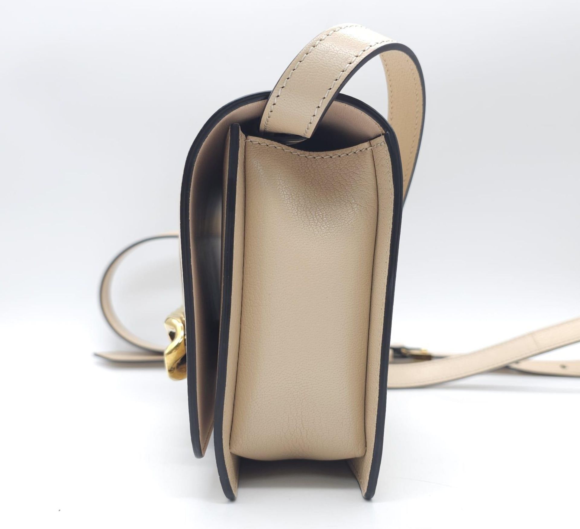 A Givenchy Nude Infinity Crossbody Bag. Leather exterior with front flap, gold toned hardware, - Bild 4 aus 12