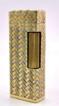 An Exquisite 18K Yellow and White Gold Lighter. Rectangular shape. Flip top with classic spinning