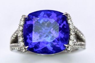 A BESPOKE 18K WHITE GOLD TANZANITE & DIAMOND RING, SET WITH AAA QUALITY CUSHION CUT 6.17CT TANZANITE