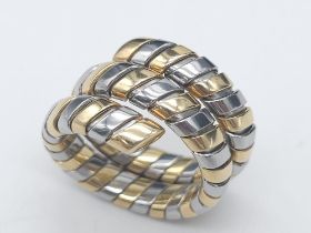 A Bulgari Tubogas Flexible 18K Gold Ring. 16 yellow gold pipe bands alternate with stainless steel