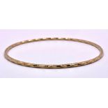 A 9K Yellow Gold Bangle with Twist Decoration. 62mm inner diameter. 7.2g weight.