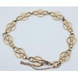 9k yellow gold openwork detailed bracelet with safety chain (19cm length), weight 6.6g