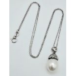 An 18K White Gold, South Sea Pearl and Diamond Pendant on an 18k White Gold Disappearing Necklace.