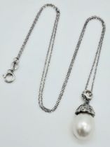 An 18K White Gold, South Sea Pearl and Diamond Pendant on an 18k White Gold Disappearing Necklace.