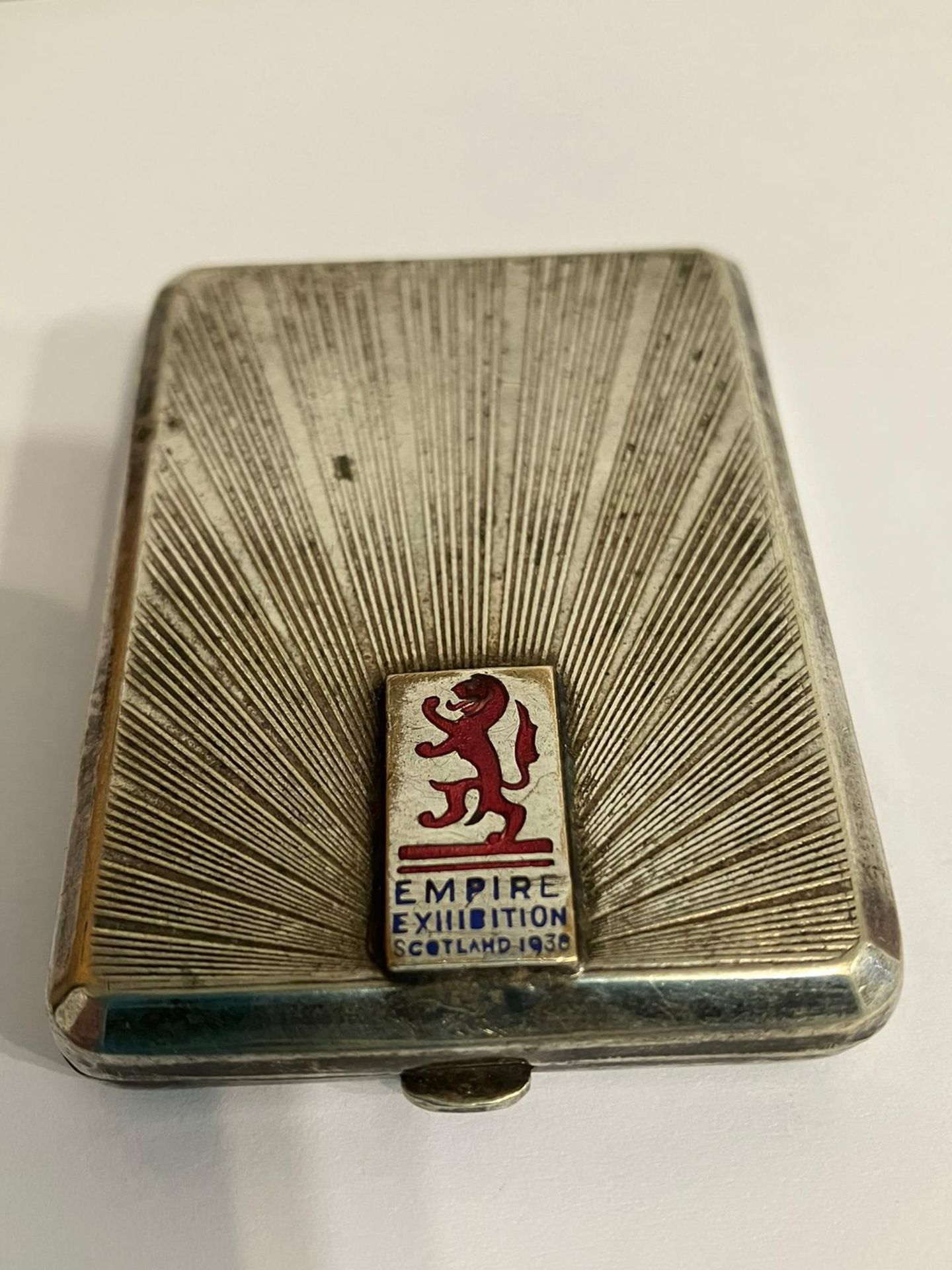 Antique SILVER PLATED MATCHBOOK CASE having the words EMPIRE EXHIBITION SCOTLAND 1938 with a rampant