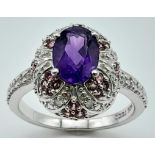 A fancy 925 silver Amethyst solitaire ring. Surrounded by zirconia. Total weight 2.9G. Size L.