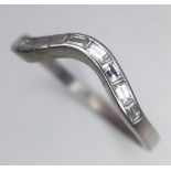 A Platinum and Diamond Swirl Ring. 10 baguette cut diamonds. Size Q. 3.45g total weight.