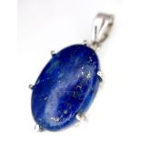 A Lapis Lazuli Cabochon 925 Silver Pendant. Oval stone on a raised foundation. 3.5cm. 8.56g total