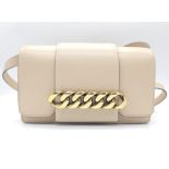 A Givenchy Nude Infinity Crossbody Bag. Leather exterior with front flap, gold toned hardware,