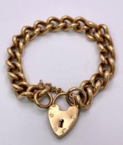 A Vintage 9K Yellow Gold Chunky Curb Link Bracelet with a Heart Clasp. 58g total weight. 17cm.
