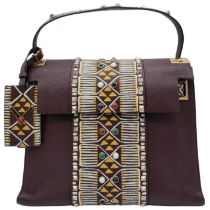 A Valentino Garavani Tribal Rockstud Bag. Quality textured leather, purple with tribal design with